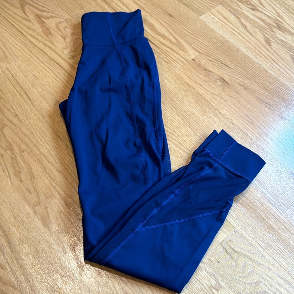Lululemon blue leggings with mesh sides on the legs size 4